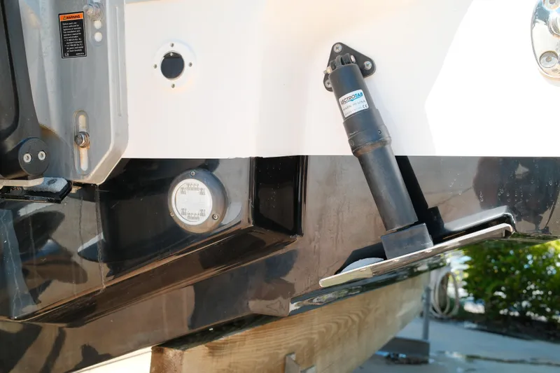 Slide: The Image of 2021 Tidewater 292 CC Adventure boat transom with trim tab and hydraulic actuator. - 21