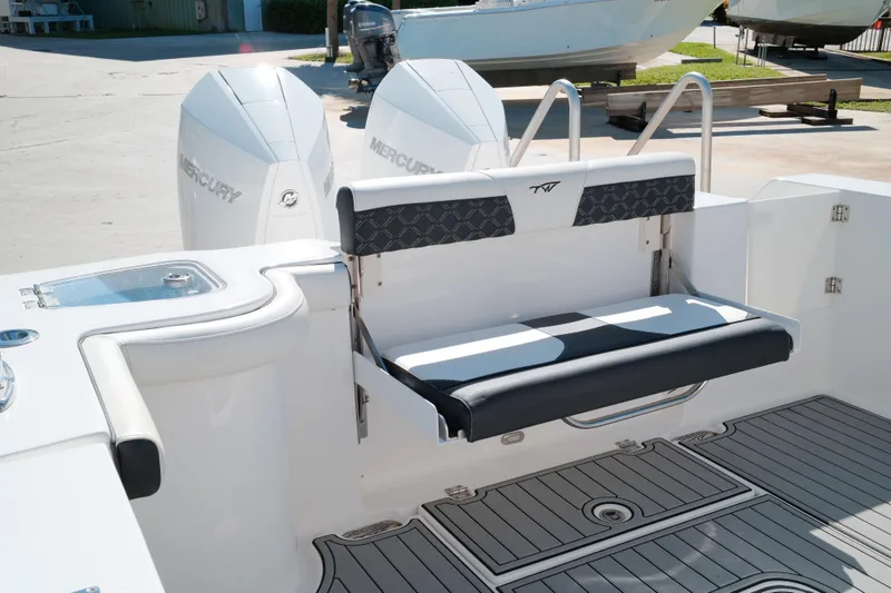 Slide: The Image of 2021 Tidewater 292 CC Adventure boat with Mercury engines and stylish seating. - 6