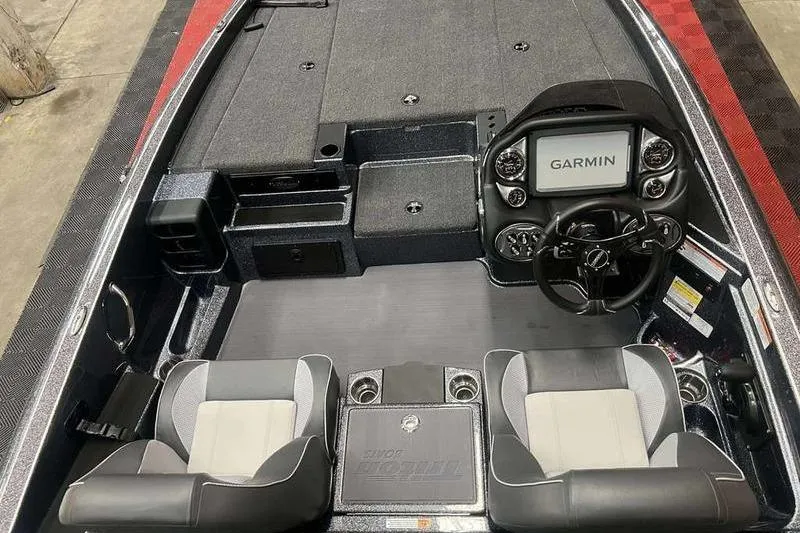 Slide: The Image of 2026 Triton 19 TrX Patriot boat interior with Garmin display and dual seating. - 3