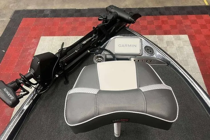 Slide: The Image of 2026 Triton 19 TrX Patriot boat with Garmin equipment and cushioned seat. - 4