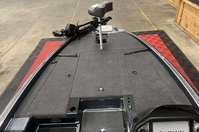 Slide: The Image of 2026 Triton 19 TrX Patriot boat deck with seat and Garmin equipment. - 5