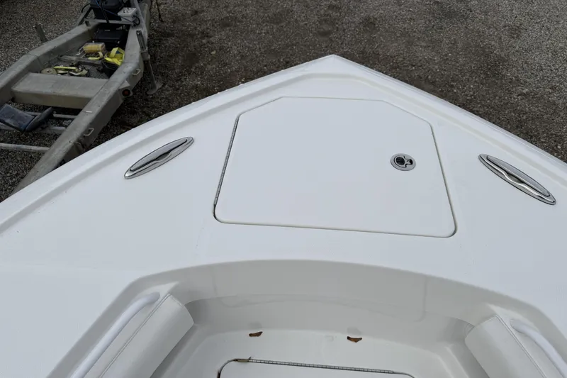 Slide: The Image of Bow of 2026 Regulator 28 boat with storage hatch and cleats. - 12