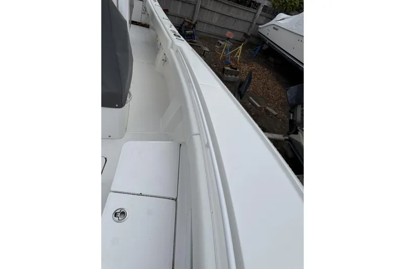 Slide: The Image of 2026 Regulator 28 boat interior, showcasing sleek white deck and seating area. - 13