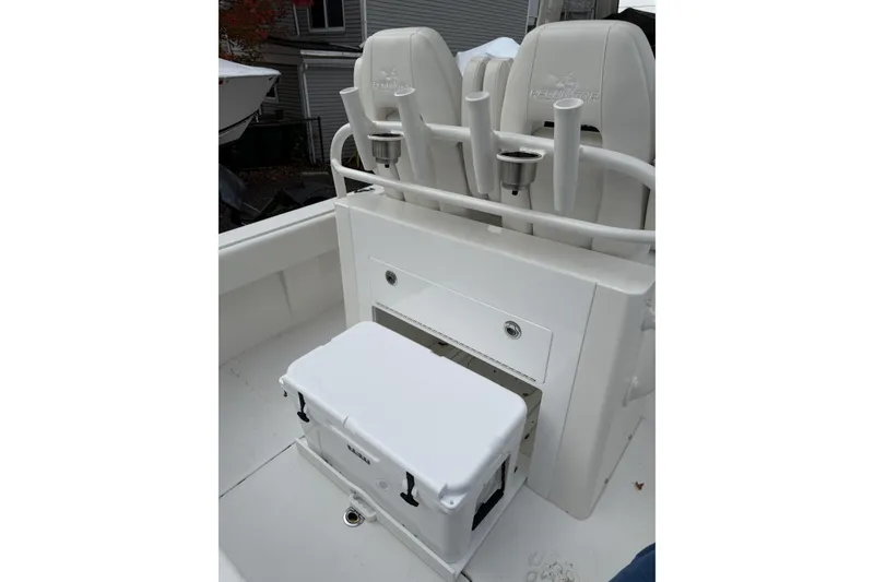 Slide: The Image of 2026 Regulator 28 boat interior with seating and storage compartments. - 16