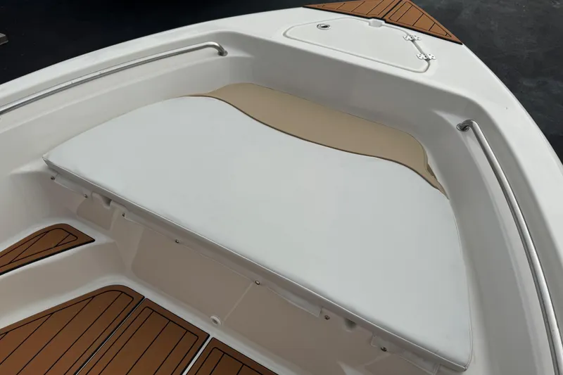 Slide: The Image of 2017 Key West 189 FS boat interior with cushioned seating and wood accents. - 107