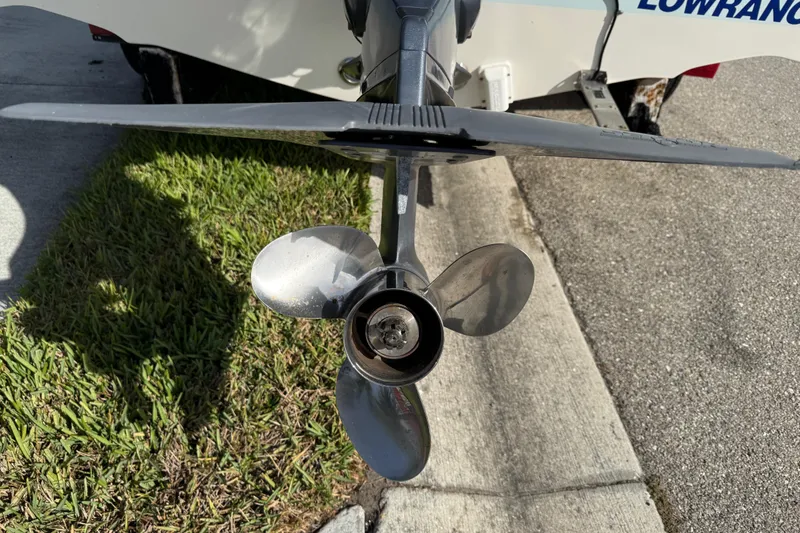 Slide: The Image of Propeller of a 2017 Key West 189 FS boat on grass and pavement. - 11