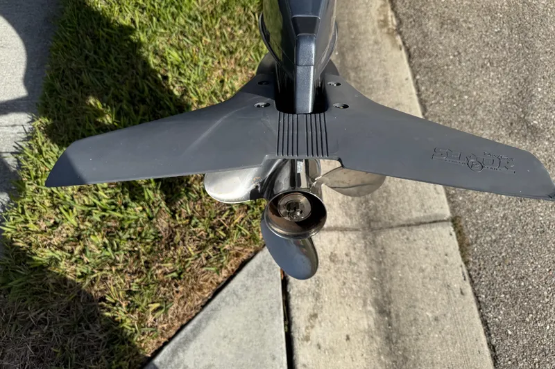 Slide: The Image of Propeller of 2017 Key West 189 FS boat on pavement and grass background. - 12