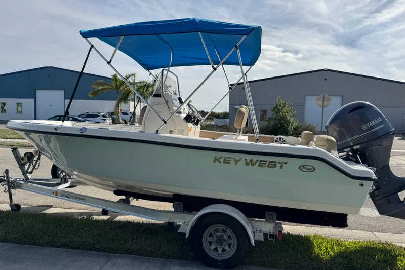 Slide: The Image of 2017 Key West 189 FS boat ladder with safety warning label. - 18