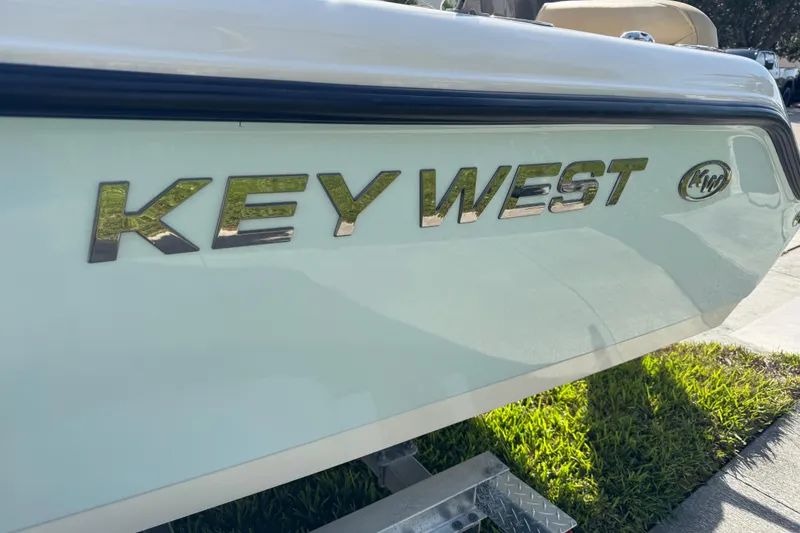 Slide: The Image of Stainless steel ladder on 2017 Key West 189 FS boat, parked on grass. - 19