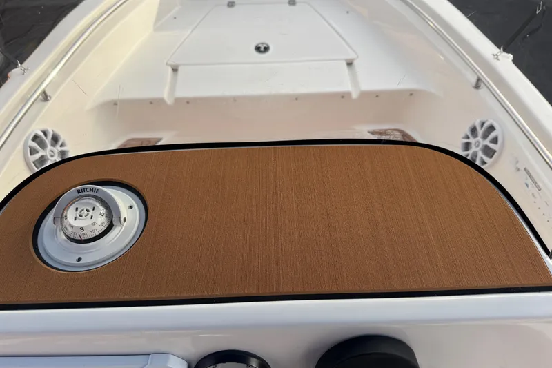 Slide: The Image of 2017 Key West 189 FS boat on trailer with blue canopy, parked outdoors. - 23