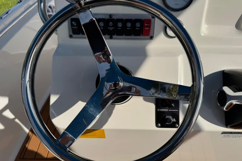 Slide: The Image of Steering console of 2017 Key West 189 FS boat with Lowrance system. - 24