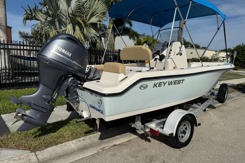 Slide: The Image of 2017 Key West 189 FS boat with Yamaha motor on trailer, blue canopy. - 3