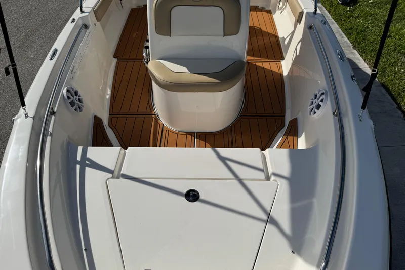 Slide: The Image of 2017 Key West 189 FS boat interior with speaker and cushioned seating. - 46