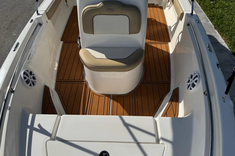 Slide: The Image of 2017 Key West 189 FS boat interior with speaker and teak flooring. - 47