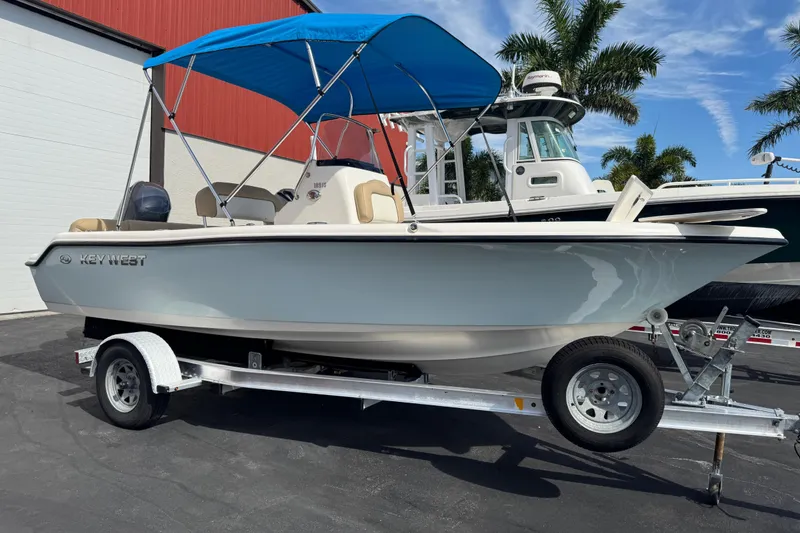 Slide: The Image of 2017 Key West 189 FS boat side view with logo in sunlight. - 5