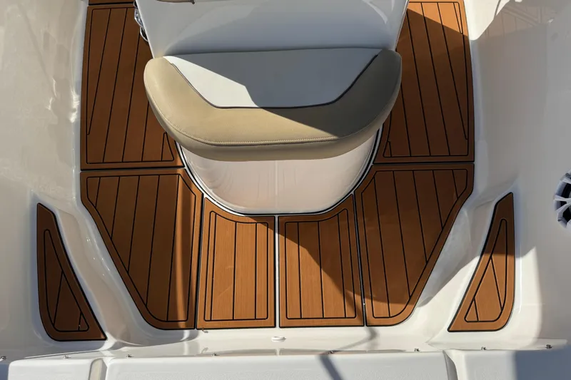 Slide: The Image of 2017 Key West 189 FS boat interior with teak flooring and cushioned seating. - 50