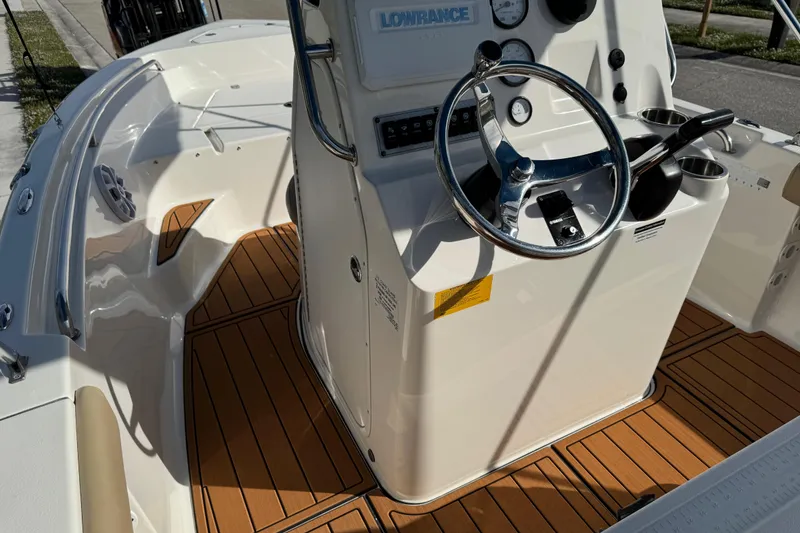 Slide: The Image of 2017 Key West 189 FS boat interior with teak flooring and cooler. - 61