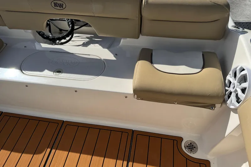 Slide: The Image of 2017 Key West 189 FS boat interior with Igloo cooler and teak flooring. - 62
