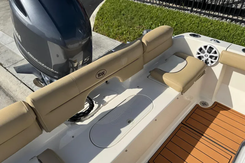 Slide: The Image of 2017 Key West 189 FS boat interior with tan seating and teak flooring. - 65