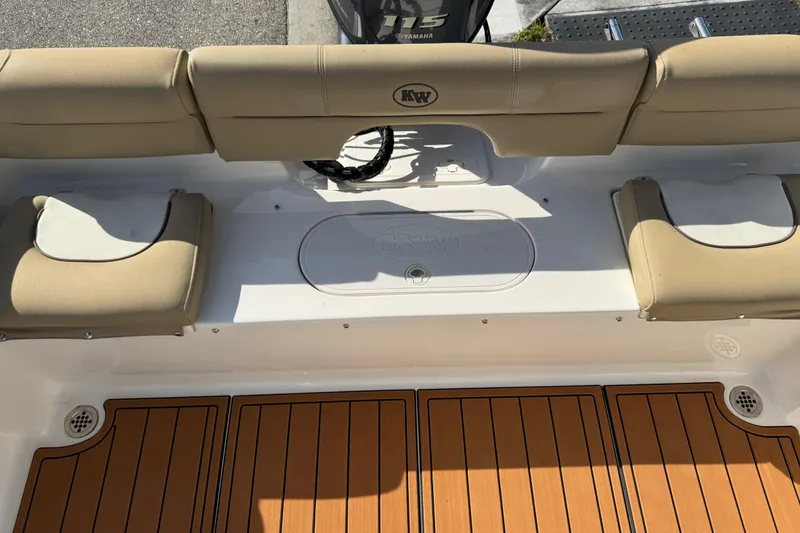 Slide: The Image of 2017 Key West 189 FS boat interior with tan seating and teak-style flooring. - 66