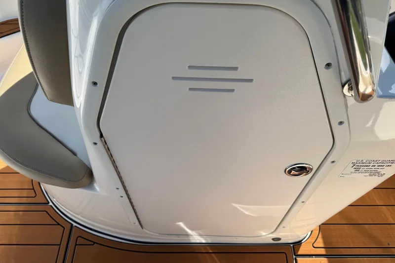 Slide: The Image of 2017 Key West 189 FS boat interior with tan seating and teak-style flooring. - 69