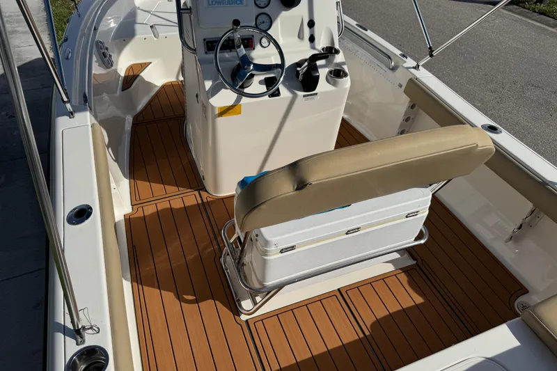 Slide: The Image of 2017 Key West 189 FS boat interior with Igloo cooler and cushioned seating. - 71