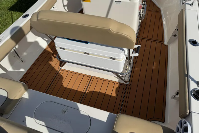 Slide: The Image of 2017 Key West 189 FS boat console with teak flooring and cushioned seating. - 72