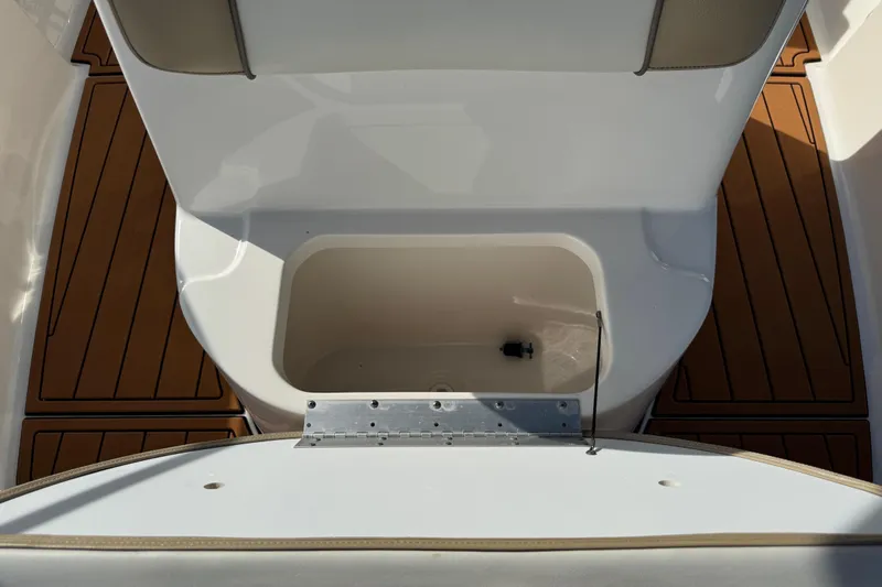 Slide: The Image of 2017 Key West 189 FS boat interior with teak flooring and stainless steel fittings. - 80