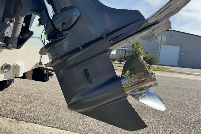 Slide: The Image of 2017 Key West 189 FS boat interior with teak flooring and rod holders. - 81