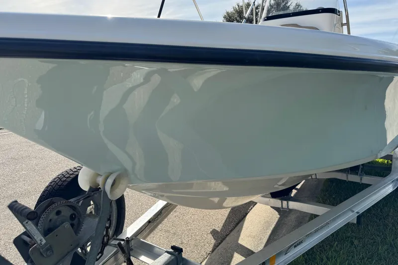 Slide: The Image of 2017 Key West 189 FS boat on trailer, side view showing hull and wheel. - 93