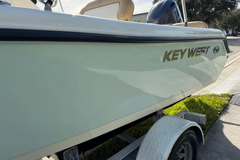 Slide: The Image of 2017 Key West 189 FS boat on trailer, side view with logo visible. - 95