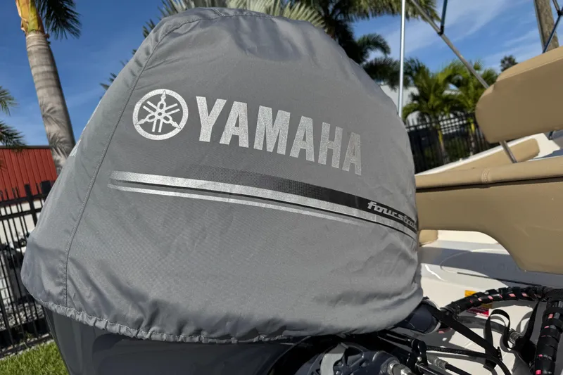 Slide: The Image of Yamaha engine cover on 2017 Key West 189 FS boat, palm trees in background. - 96