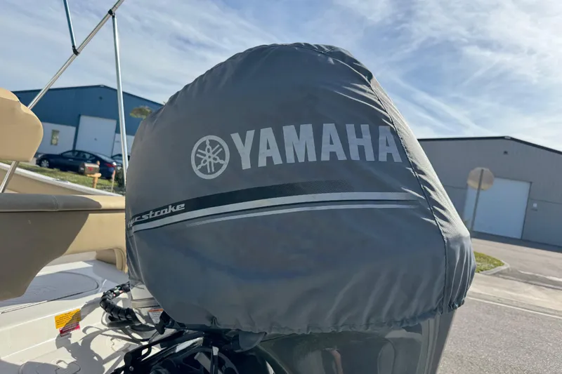 Slide: The Image of 2017 Key West 189 FS boat with Yamaha engine cover, parked outdoors. - 99