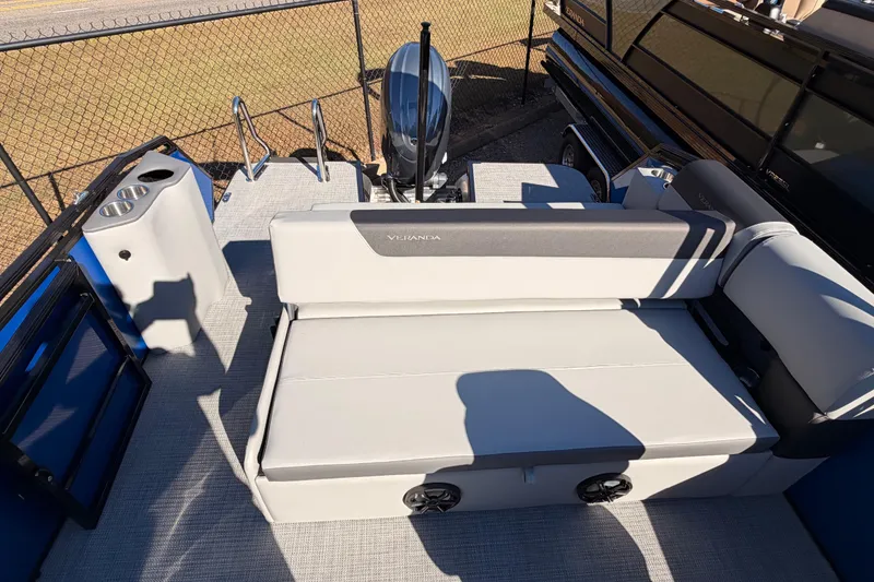 Slide: The Image of 2026 Veranda VR 235 VL pontoon boat interior with seating and motor view. - 11
