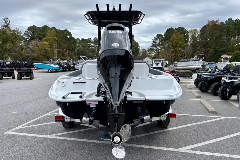 Slide: The Image of 2026 ALK2 Powerboats 23 CRX with outboard motor in a parking lot. - 3