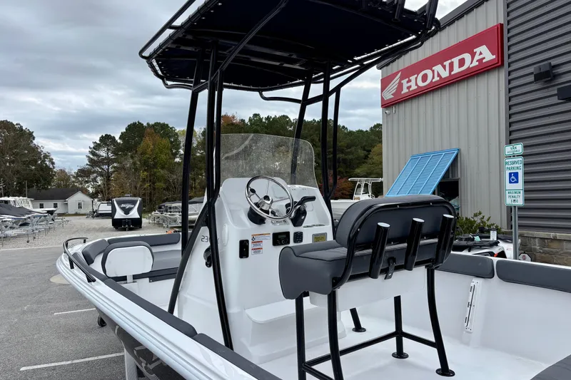 Slide: The Image of 2026 ALK2 Powerboats 23 CRX at dealership, featuring sleek design and modern controls. - 5
