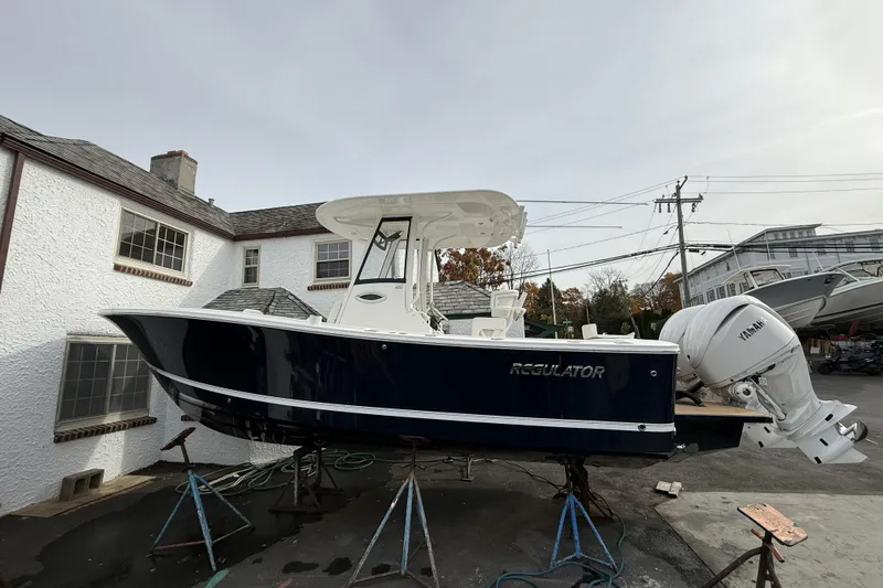 The Image of 2026 Regulator 25 boat with Yamaha engine, displayed outdoors near buildings. - 0