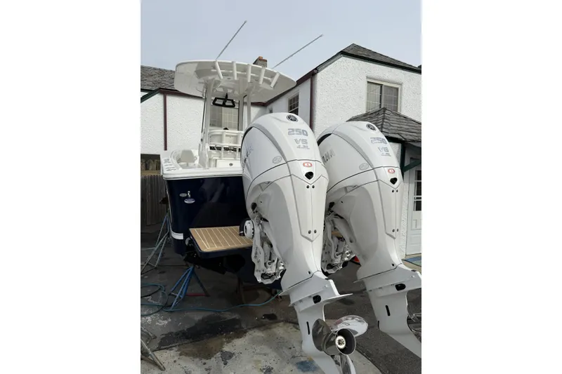 Slide: The Image of 2026 Regulator 25 boat with dual Yamaha 250 V6 outboard engines. - 4