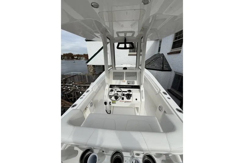 Slide: The Image of 2026 Regulator 25 boat cockpit with modern controls and white seating. - 9