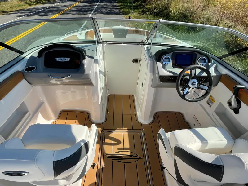Slide: The Image of 2024 Chaparral 23 SSi OB boat interior with modern dashboard and seating. - 18