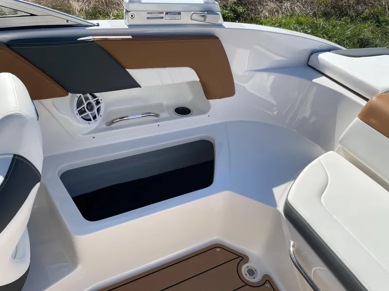 Slide: The Image of Interior seating and storage area of the 2024 Chaparral 23 SSi OB boat. - 31
