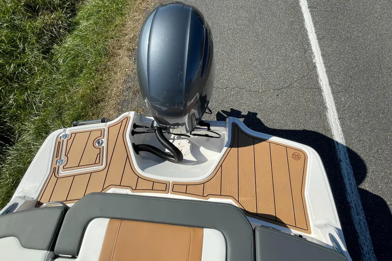 Slide: The Image of 2024 Chaparral 23 SSi OB boat with outboard motor and teak deck. - 43