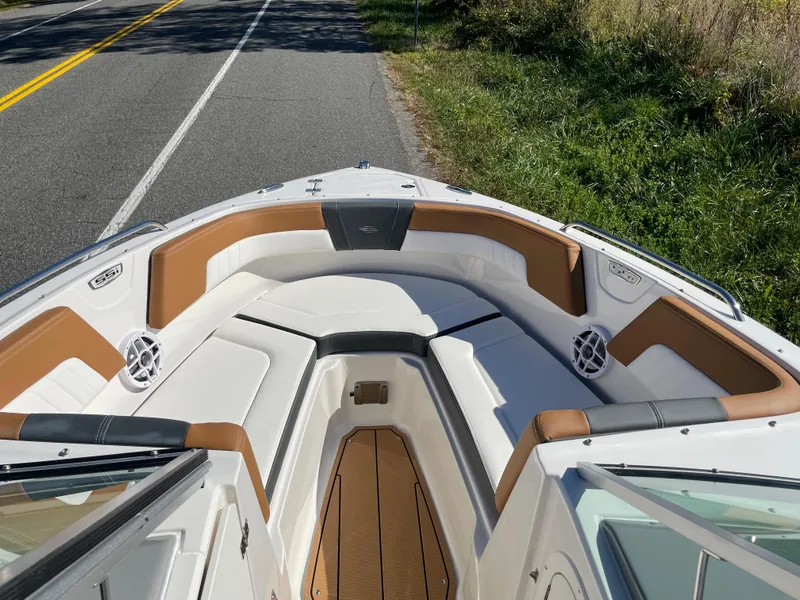 Slide: The Image of 2024 Chaparral 23 SSi OB boat with spacious bow seating and modern design. - 8