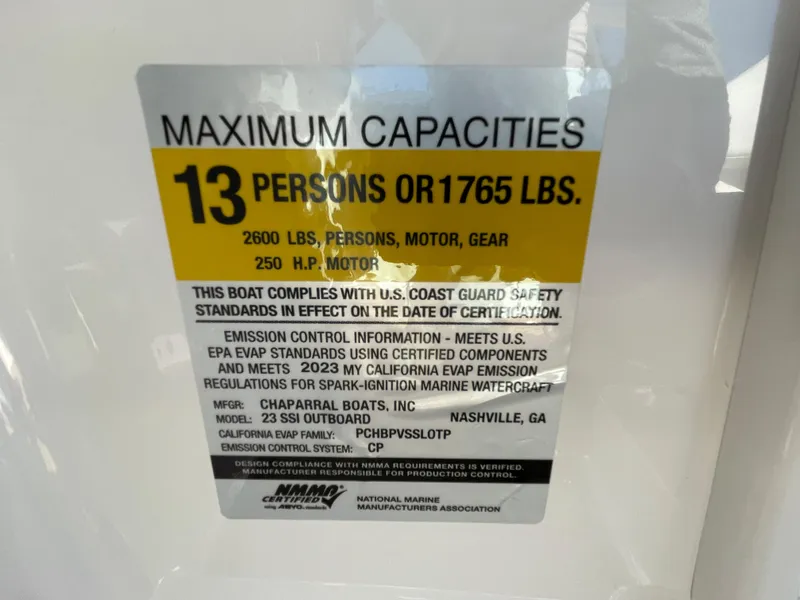Slide: The Image of 2024 Chaparral 23 SSi OB boat capacity label: 13 persons or 1765 lbs. - 23