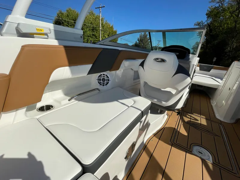 Slide: The Image of 2024 Chaparral 23 SSi OB boat interior with white and tan seating. - 30