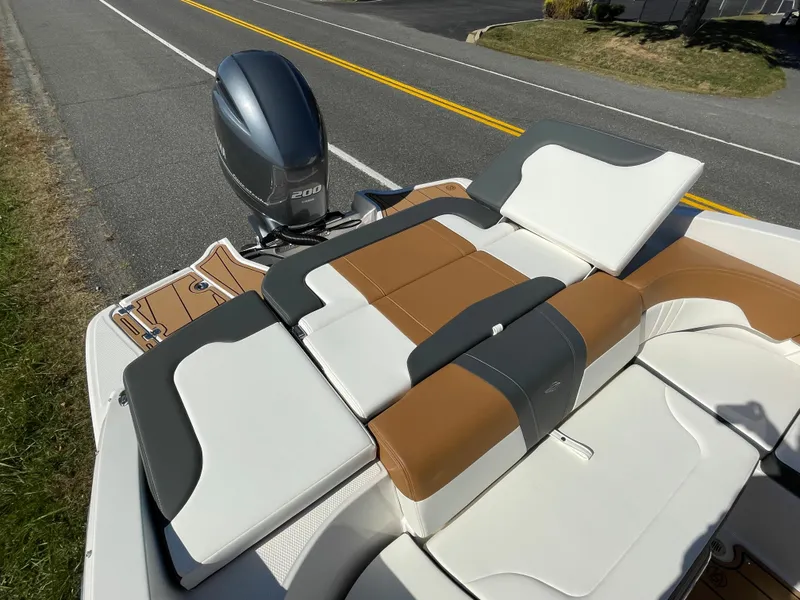 Slide: The Image of 2024 Chaparral 23 SSi OB boat with Yamaha outboard motor, featuring luxurious seating. - 41