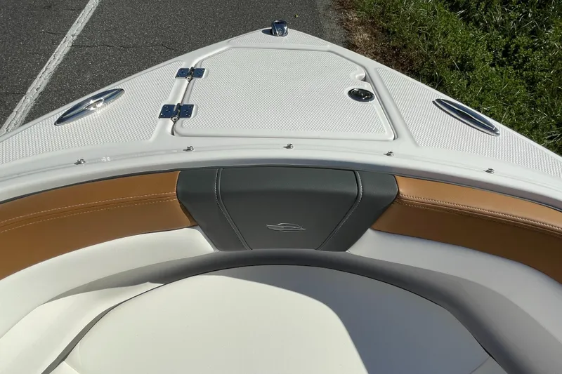 Slide: The Image of 2024 Chaparral 23 SSi OB boat bow seating and storage compartment. - 7