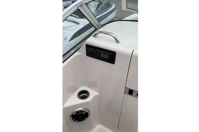 Slide: The Image of 2014 Grady-White Freedom 205 boat interior with control panel and cup holder. - 14