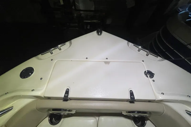 Slide: The Image of 2014 Grady-White Freedom 205 boat deck with storage compartment and stainless steel fittings. - 20