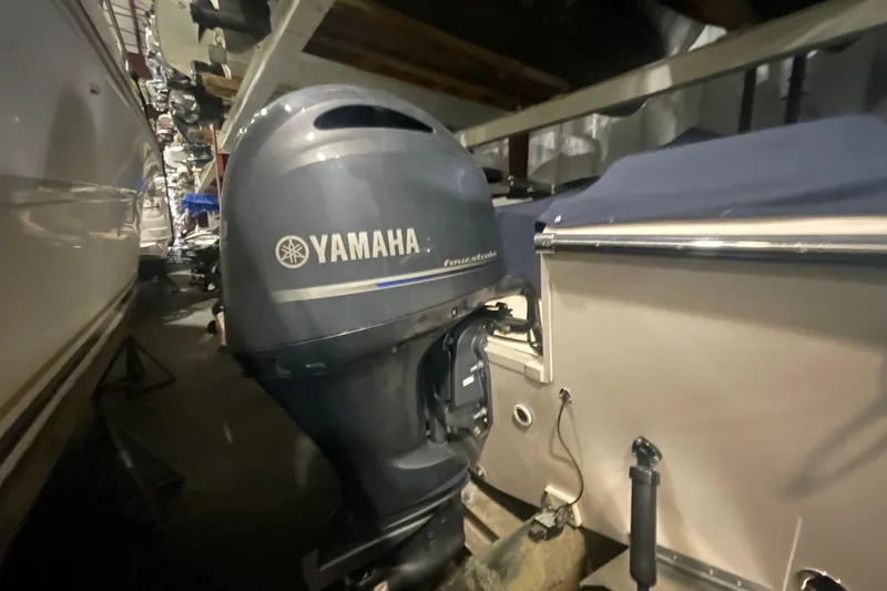 Slide: The Image of 2014 Grady-White Freedom 205 boat with Yamaha outboard motor in storage. - 22